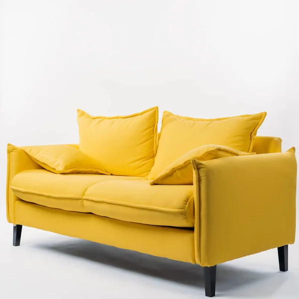 Studio shot of yellow couch with pillows, on white — Stock Image Studio Shot Yellow Couch Pillows White Stock Photo