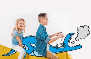 happy siblings riding drawn blue dragon while sitting on sofa  clipart