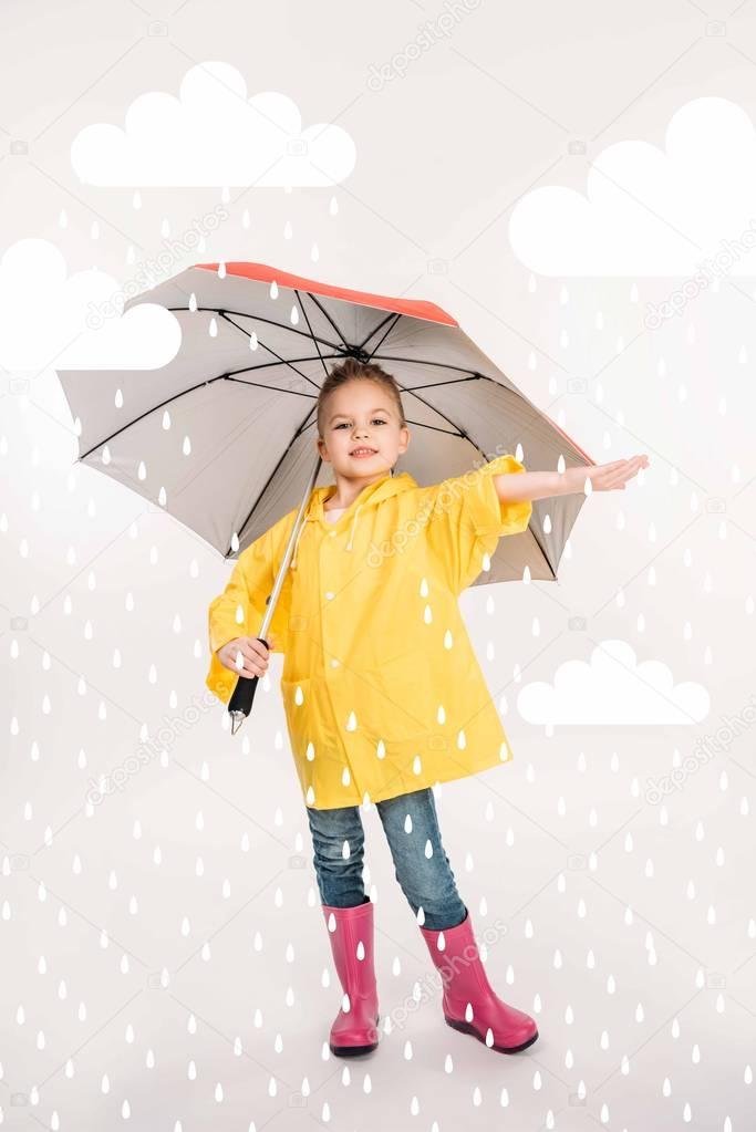 pretty child in rubber boots, yellow raincoat with umbrella, rainy weather