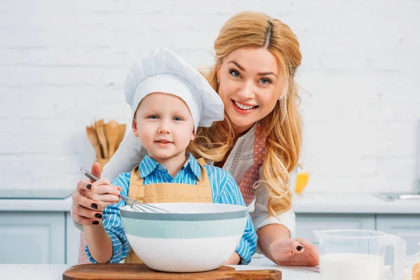 Mother Holding Son While Using Hand Beater — Stock Photo, Image