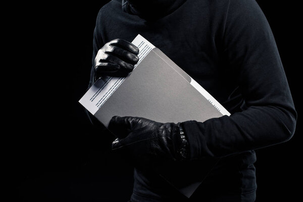 Close-up view of confident documents in hands of thief