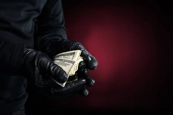 Άνθρωπος Μαύρα Γάντια Κρατώντας Δολάριο Τραπεζογραμματίων — Φωτογραφία Αρχείου