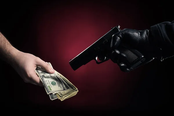 Burglar Gun Robbing Man Dollars — Free Stock Photo