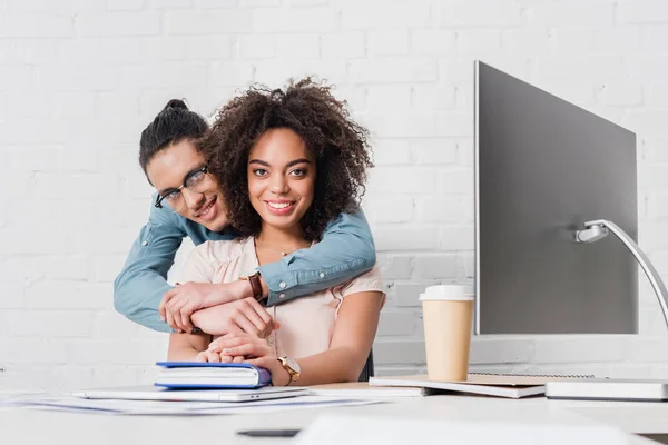 African American Businessman Hugging Young Woman Table Computer Office — Stock Photo, Image