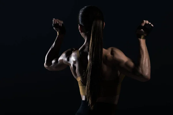Вид Сзади Сильной Женщины Бодибилдера Позирующей Демонстрирующей Мышцы Изолированной Черном — стоковое фото