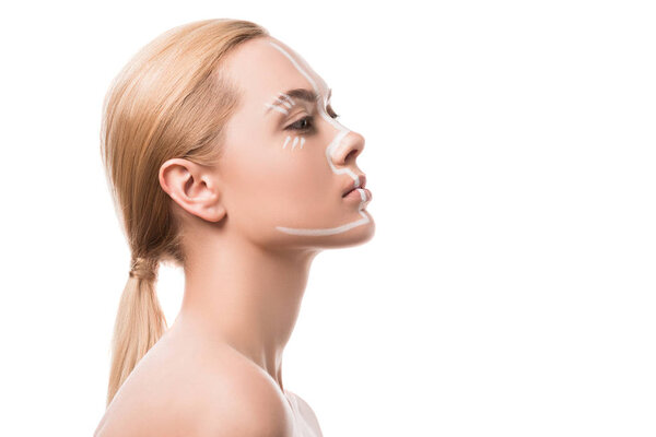 side view of beautiful woman with white lines on face isolated on white