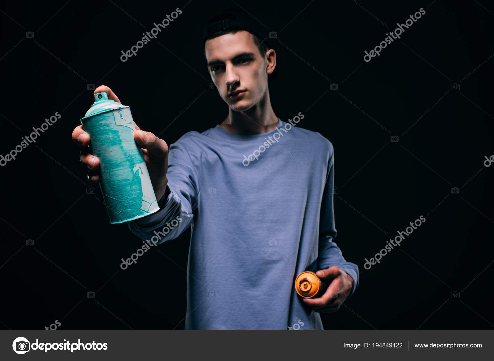 Young Man Painting Spray Paint Isolated Black Stock Photo by