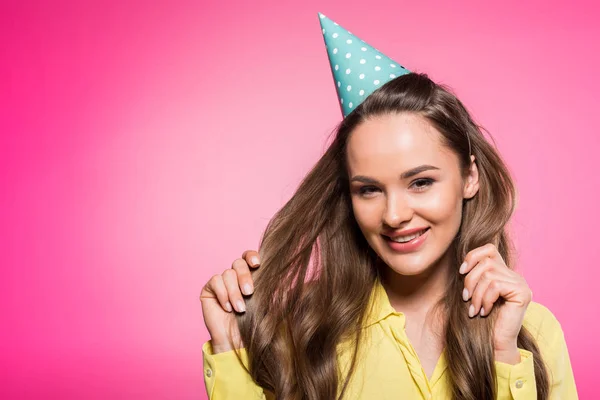 Smiling Attractive Woman Party Hat Touching Hair Isolated Pink — Free Stock Photo