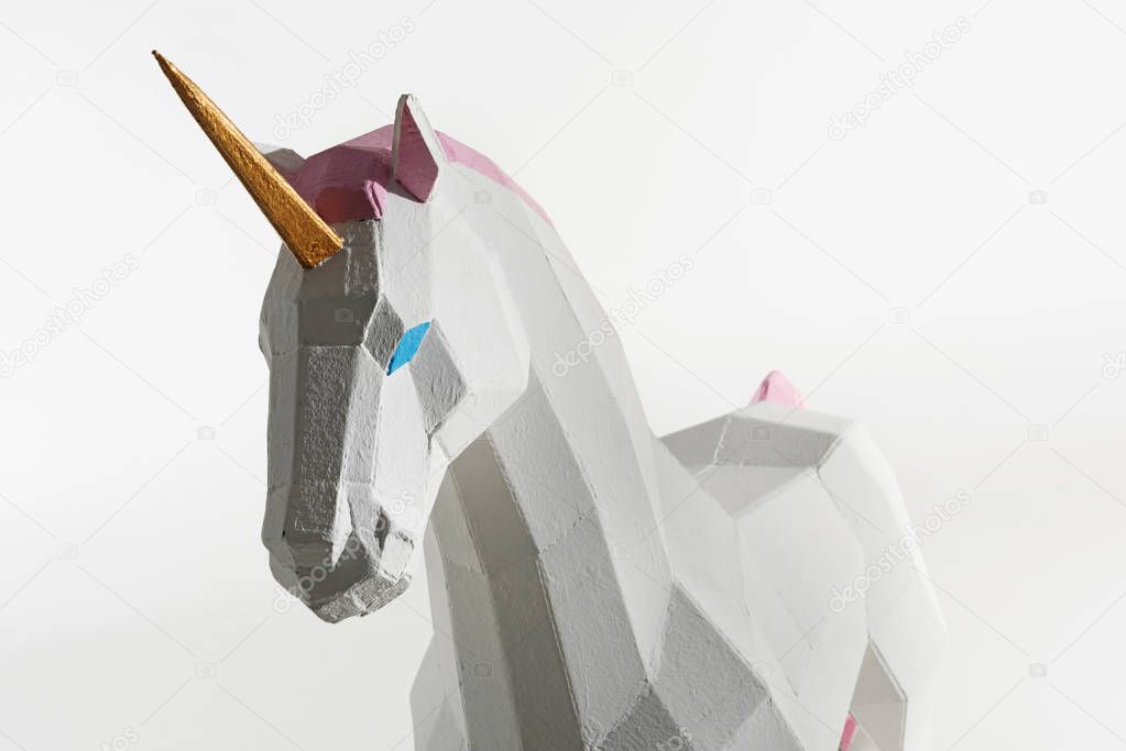 unicorn toy with golden horn isolated on white
