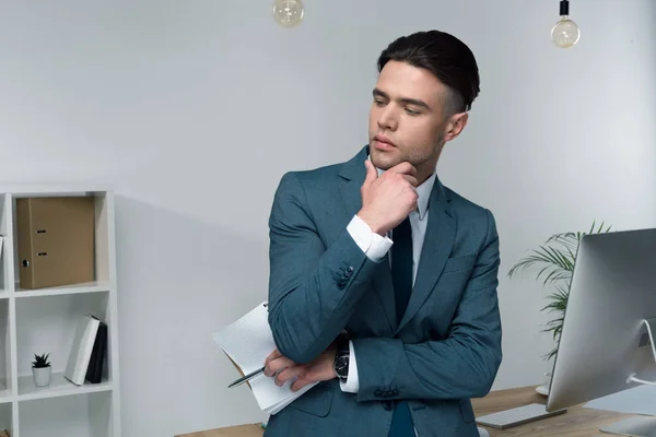 Young businessman at workplace — Stock Photo