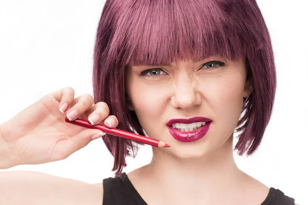 Woman holding makeup pencil — Stock Photo