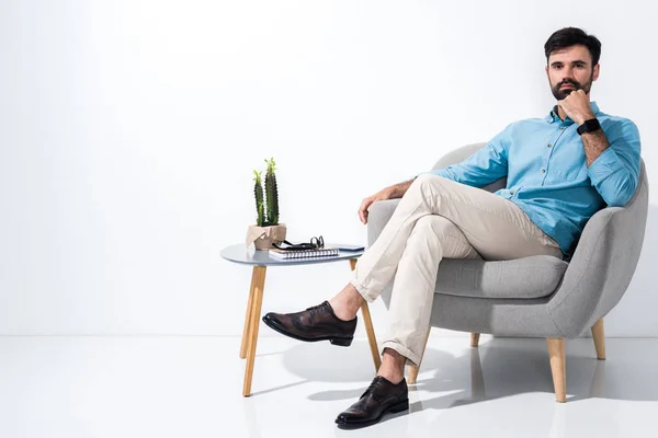 Businessman sitting in chair — Stock Photo