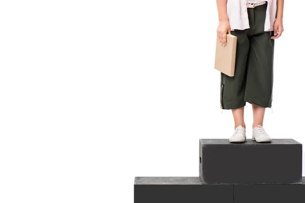 Écolier avec livre sur le podium — Photo de stock