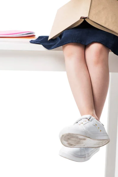 Schoolgirl reading book — Stock Photo