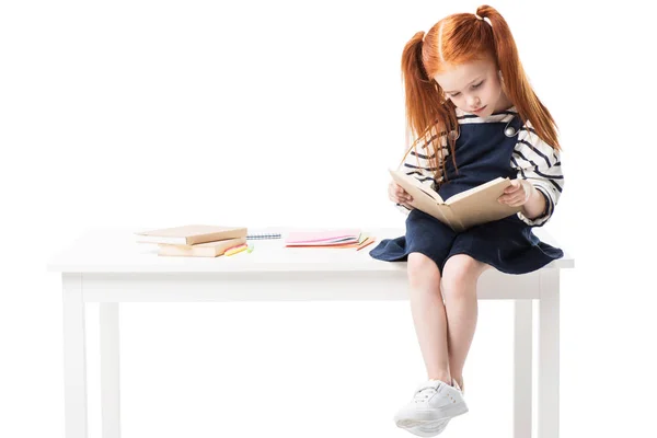 Schoolgirl reading book — Stock Photo