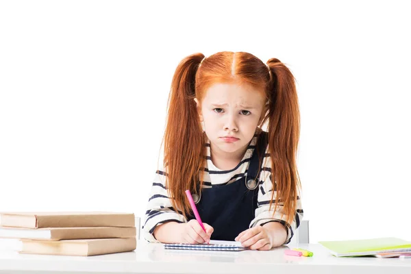 Schoolgirl drawing in notebook — Stock Photo