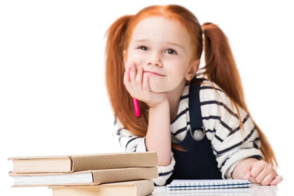 Schoolgirl drawing in notebook — Stock Photo