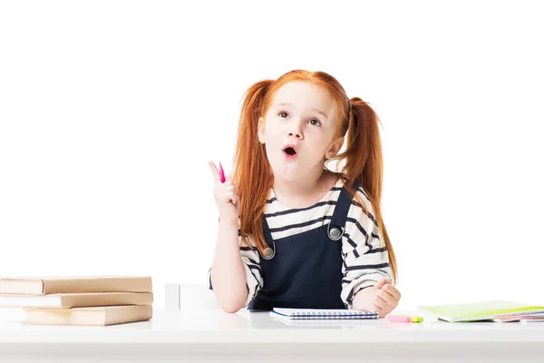 Schoolgirl drawing in notebook — Stock Photo