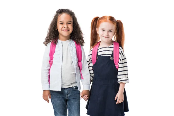 Colegialas multiétnicas con mochilas - foto de stock