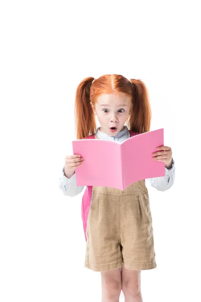 Surprised schoolgirl with book — Stock Photo