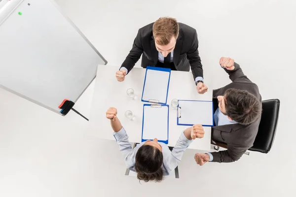 Excited business people at meeting — Stock Photo