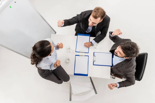 Excited business people at meeting — Stock Photo