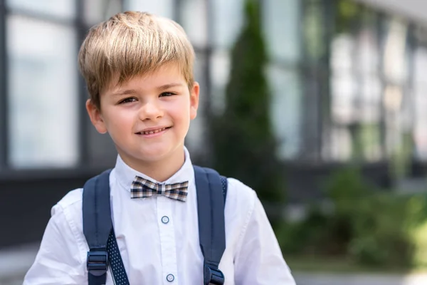 Stylish schoolboy with backpack — Stock Photo