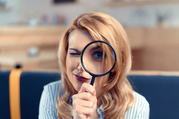 Businesswoman with magnifier — Stock Photo