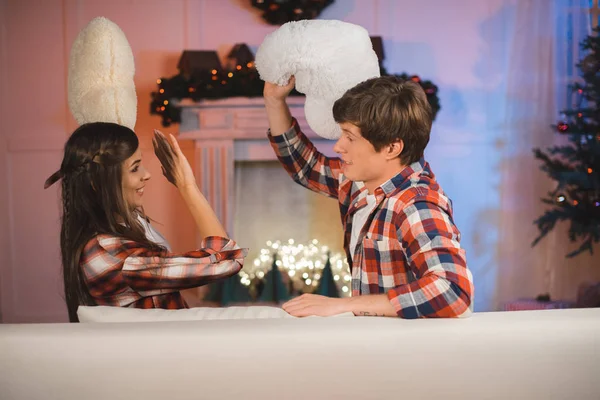 Couple having pillow fight — Stock Photo