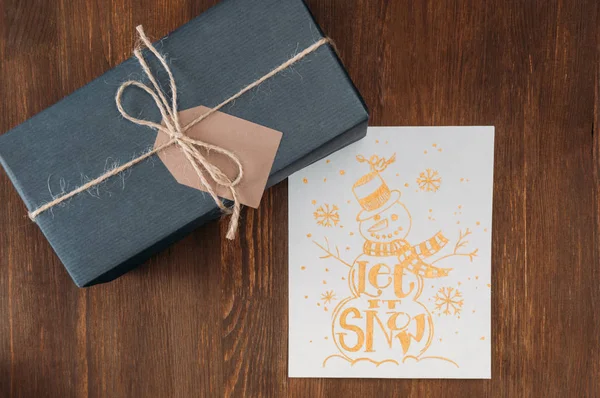 Gift box and christmas card — Stock Photo