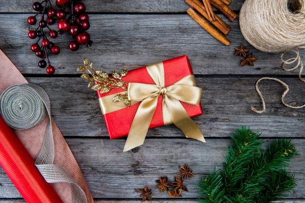 Christmas present with golden ribbon — Stock Photo
