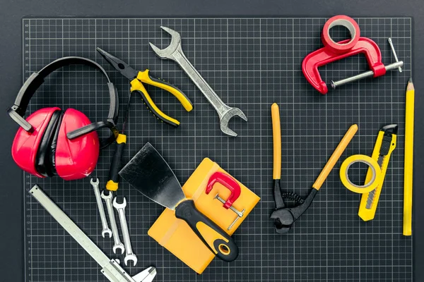 Reparement tools on graph paper — Stock Photo