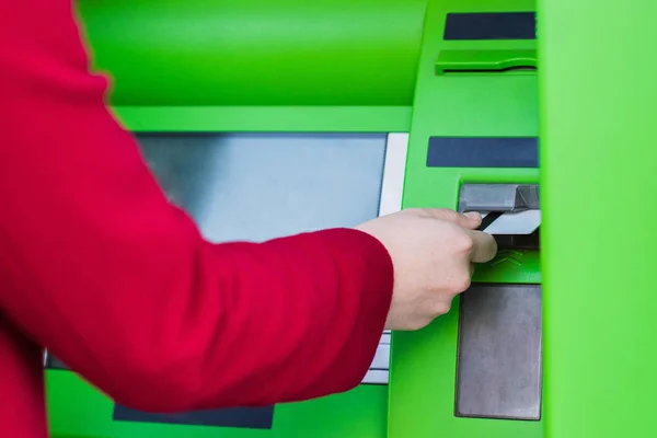 Putting credit card into atm — Stock Photo