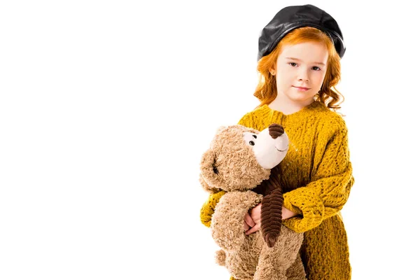 Red hair child holding teddy bear and looking at camera isolated on white — Stock Photo