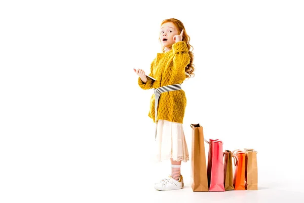 Red hair kid showing idea gesture on white — Stock Photo