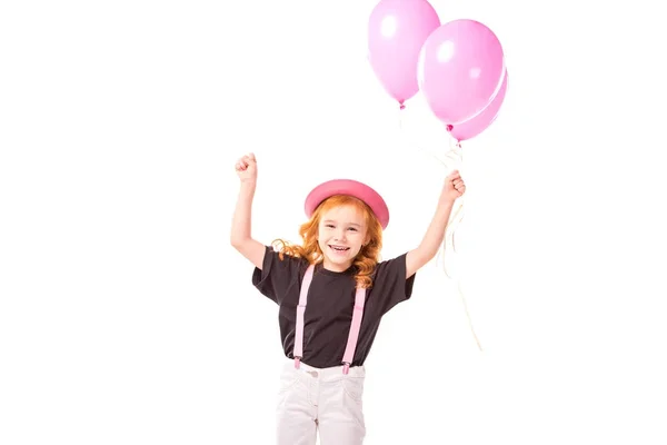 Happy red hair kid standing with pink balloons isolated on white — Stock Photo