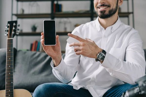Cropped image of technology blogger pointing on new smartphone — Stock Photo