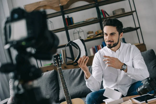 Handsome technology blogger recording new vlog about virtual reality headset — Stock Photo