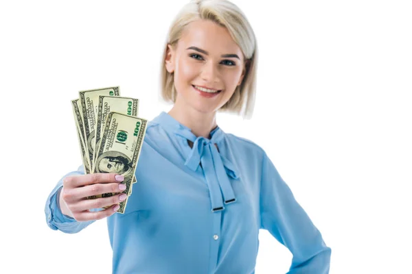 Feliz mujer de negocios sosteniendo billetes de dólar, aislados en blanco - foto de stock