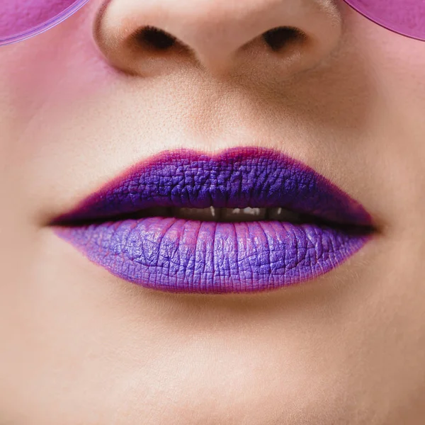 Cropped image of female purple lips — Stock Photo