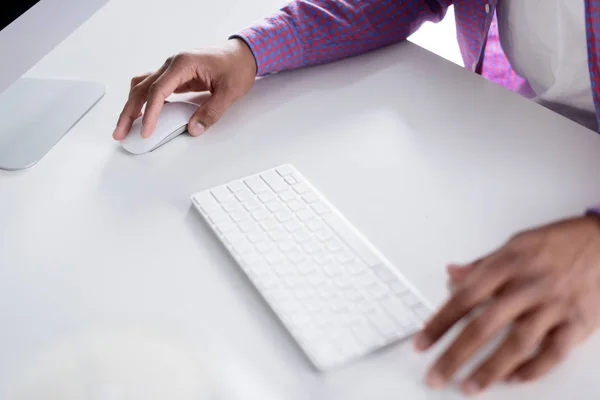 Cropped image of african american man using computer — Stock Photo