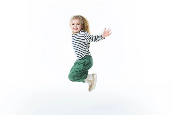 Azione colpo di piccolo bambino che salta isolato su bianco — Foto stock