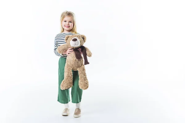 Élégant petit enfant avec ours en peluche isolé sur blanc — Photo de stock