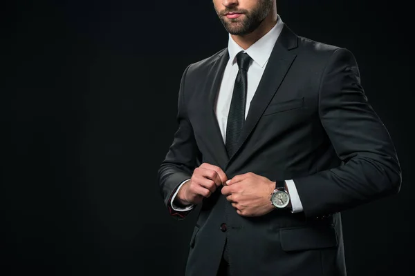 Vista recortada de hombre de negocios en chaqueta, aislado en negro - foto de stock