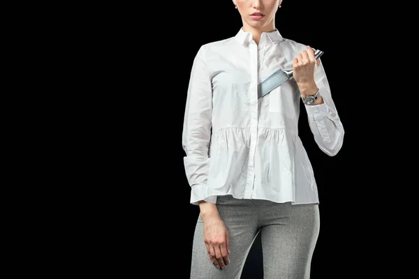 Cropped view of businesswoman with knife, isolated on black — Stock Photo