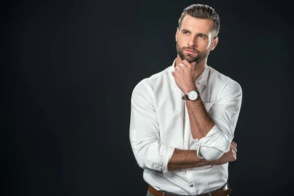 Schöner nachdenklicher Geschäftsmann in weißem Hemd, isoliert auf schwarz — Stockfoto