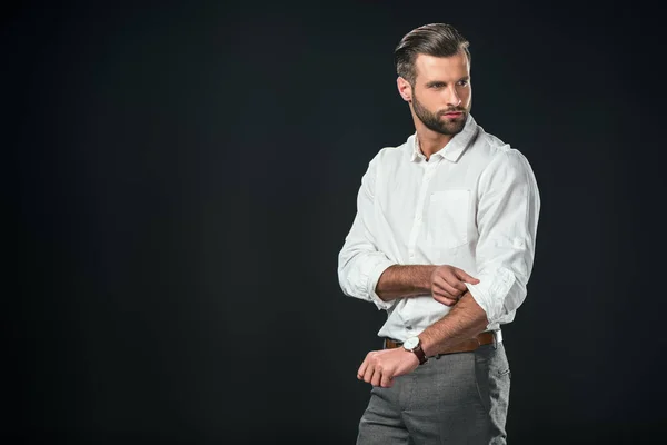 Homem de negócios bonito em camisa branca, isolado em preto — Fotografia de Stock