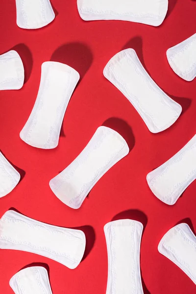 Top view of collection of daily liners on red — Stock Photo