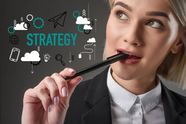 Portrait of beautiful young businesswoman with pen, strategy concept — Stock Photo