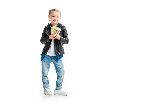 Happy little kid in leather jacket holding banknotes isolated on white — Stock Photo